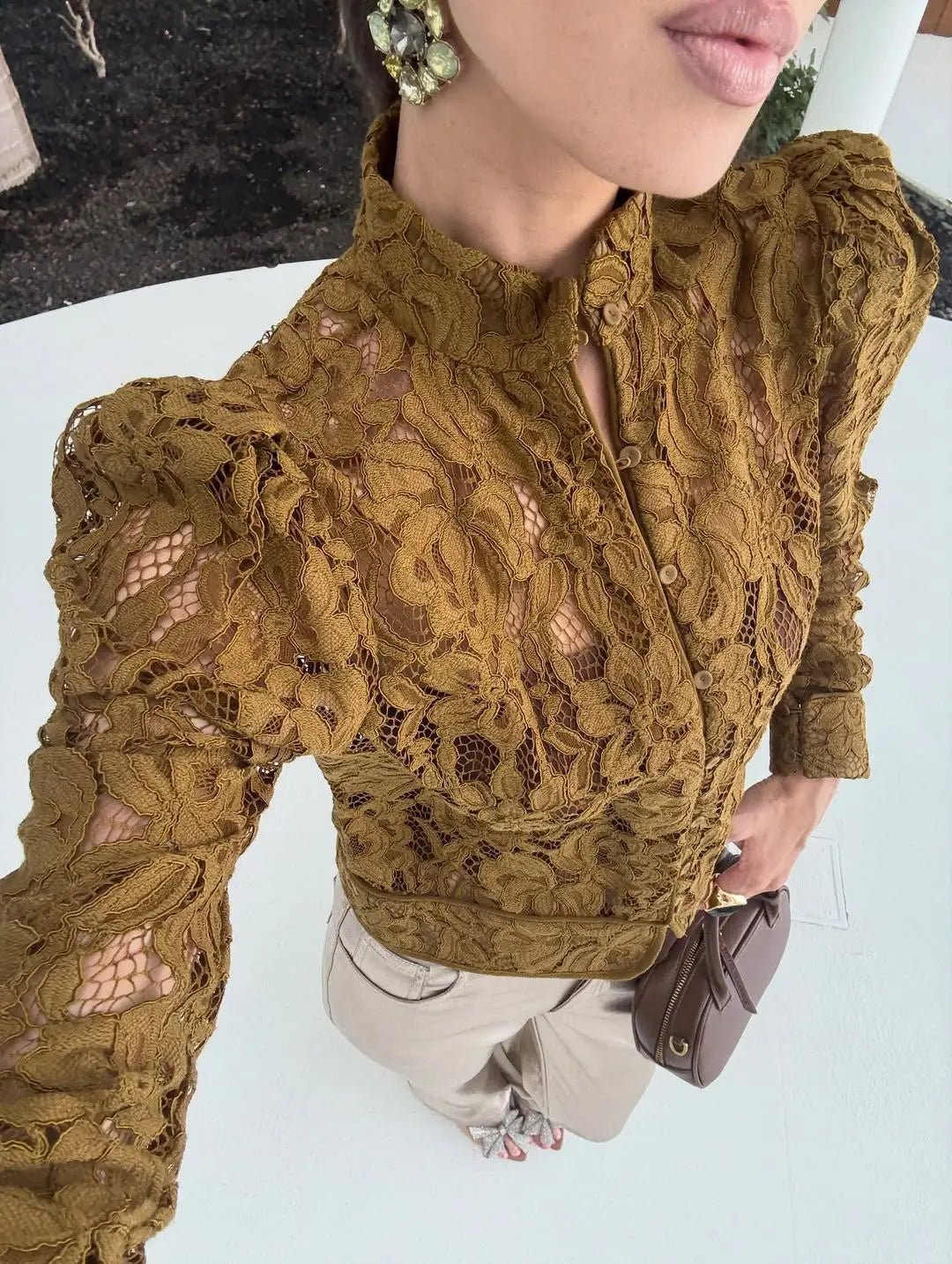 Blusa trasparente in pizzo Azzurra