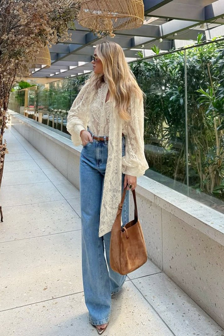 Blusa Dunja in pizzo trasparente con laccetto