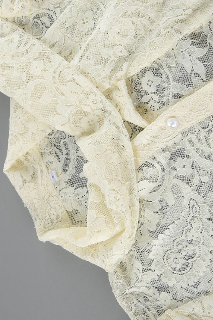 Blusa Dunja in pizzo trasparente con laccetto
