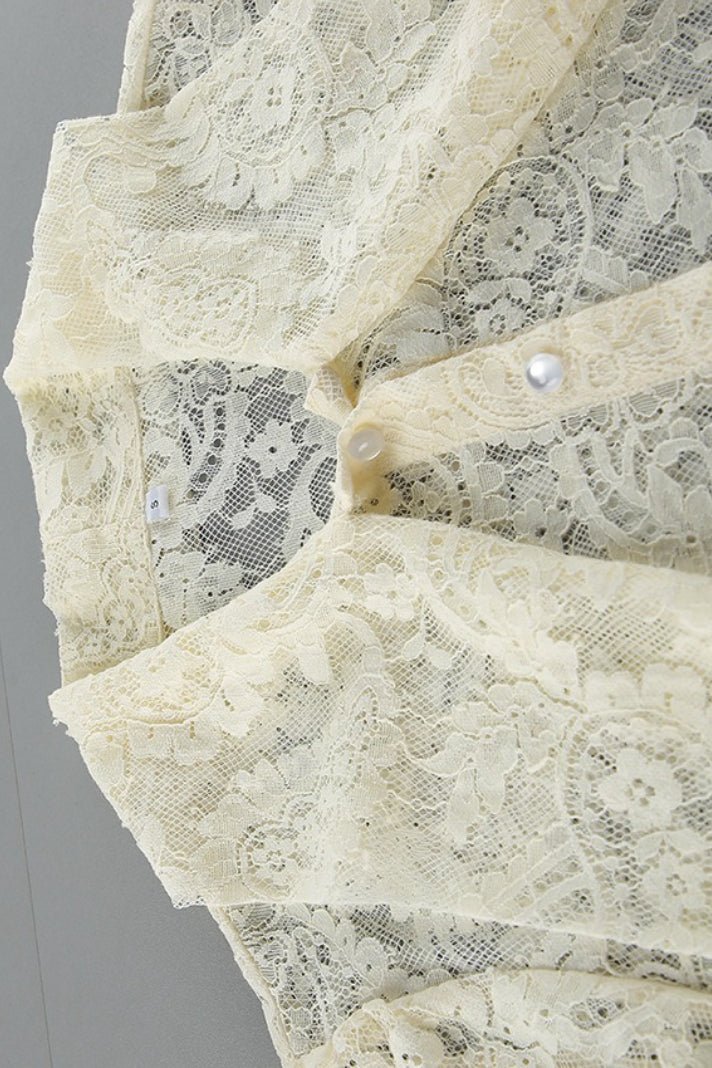 Blusa Dunja in pizzo trasparente con laccetto
