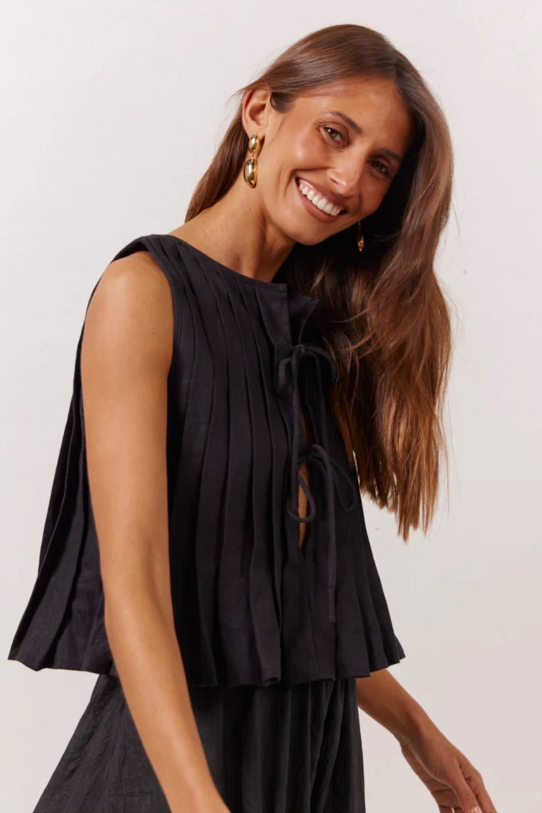 Top Honora con orlo a balze e allacciatura frontale