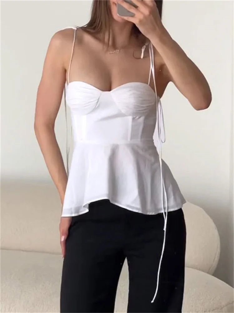 Top a canotta con corsetto e peplo Jada