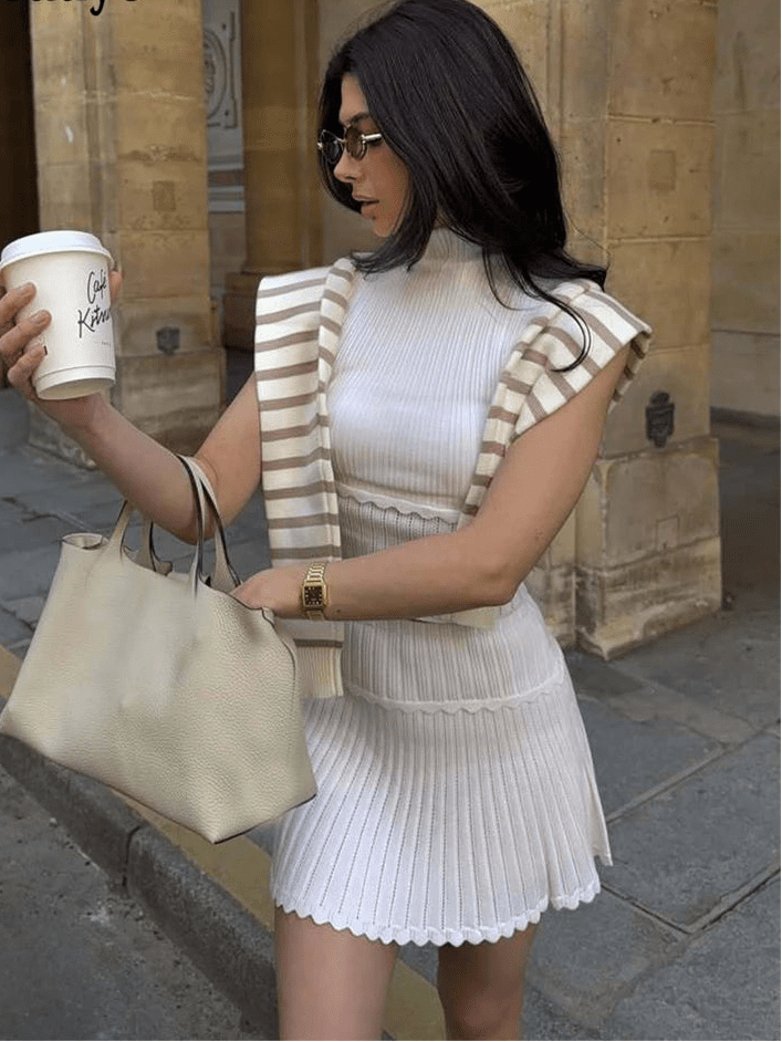 Completo a due pezzi con top corto in maglia e minigonna plissettata Kelly