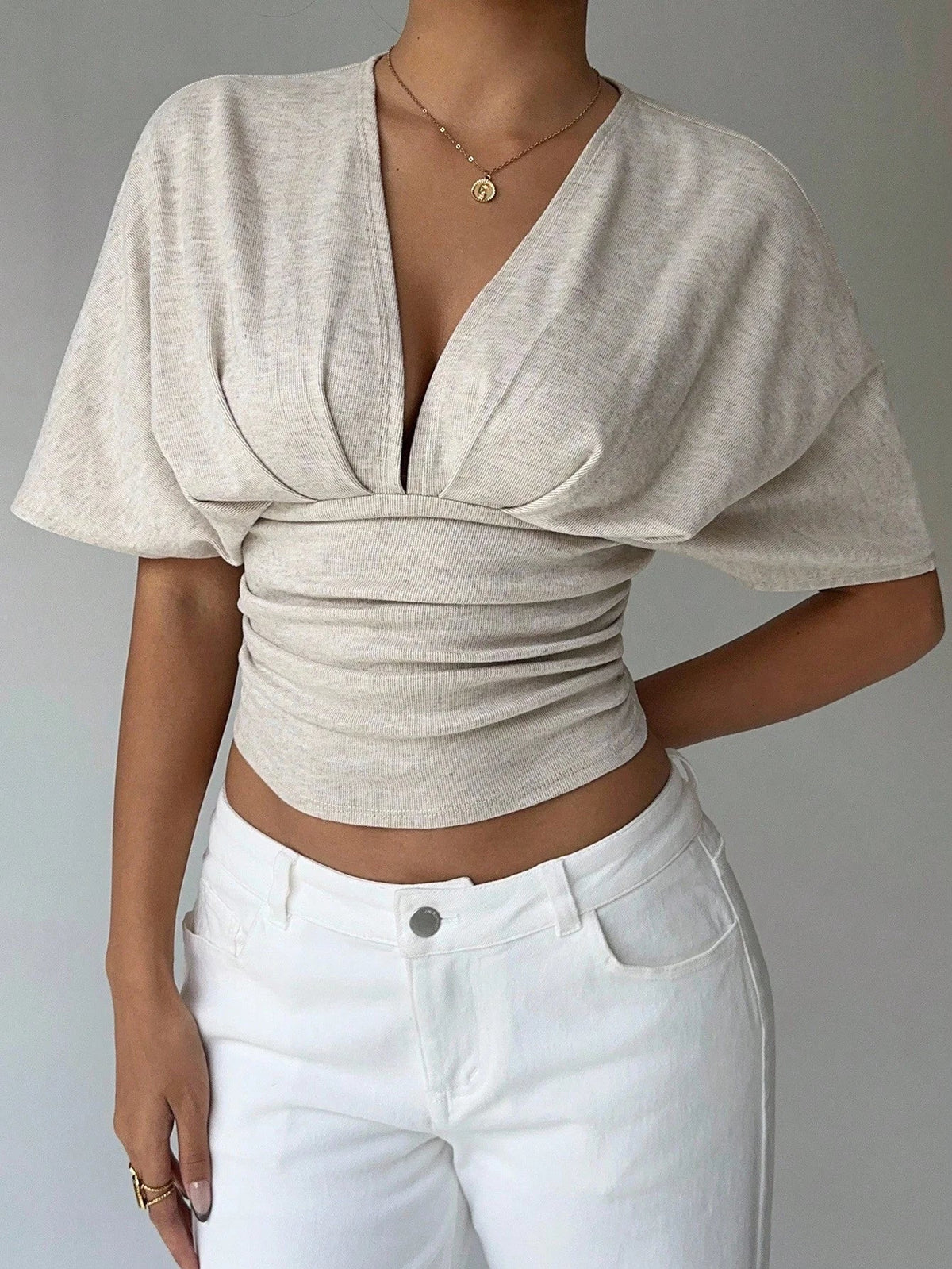 Blusa aderente con scollo profondo Kendra
