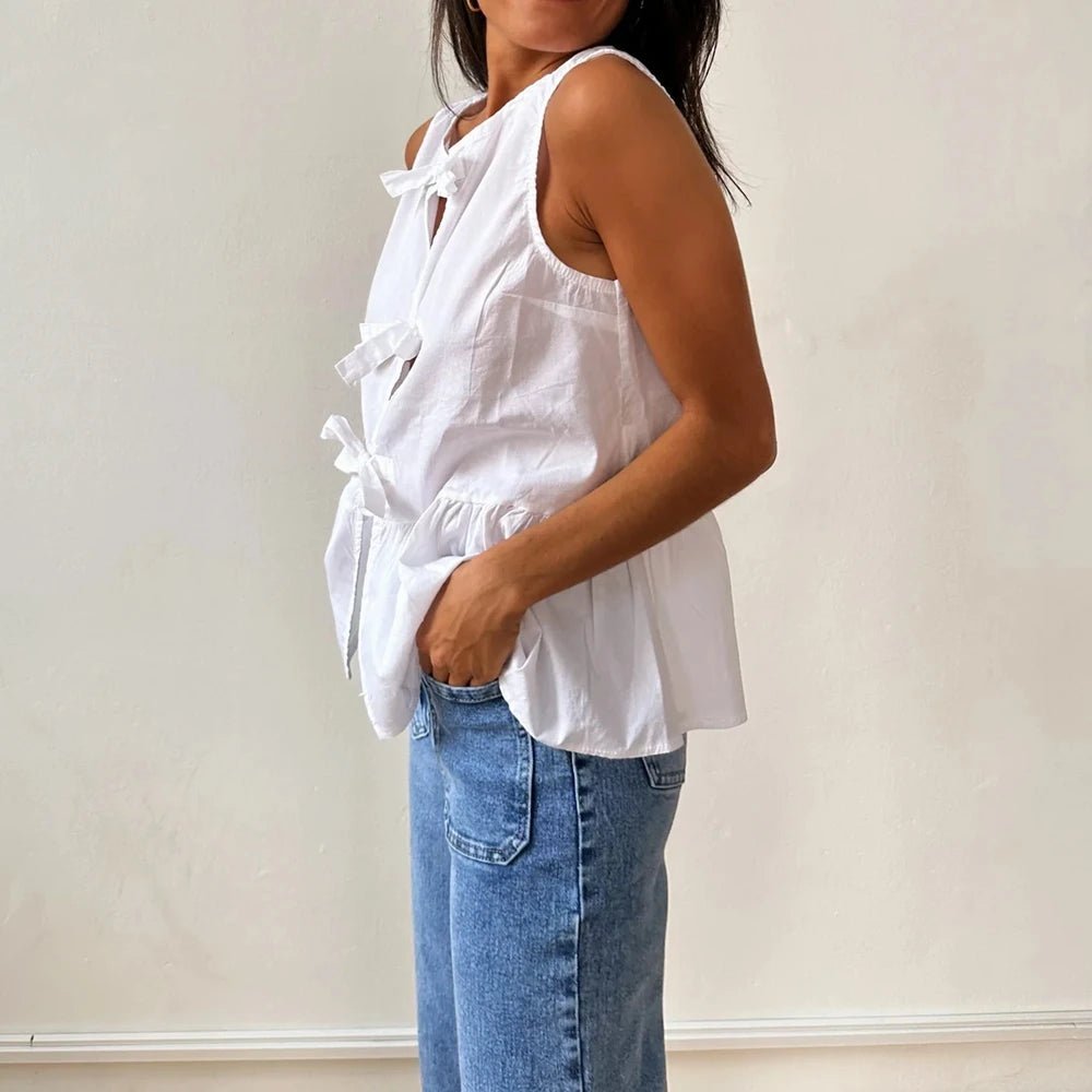 Top smanicato peplum Lisette con fiocco