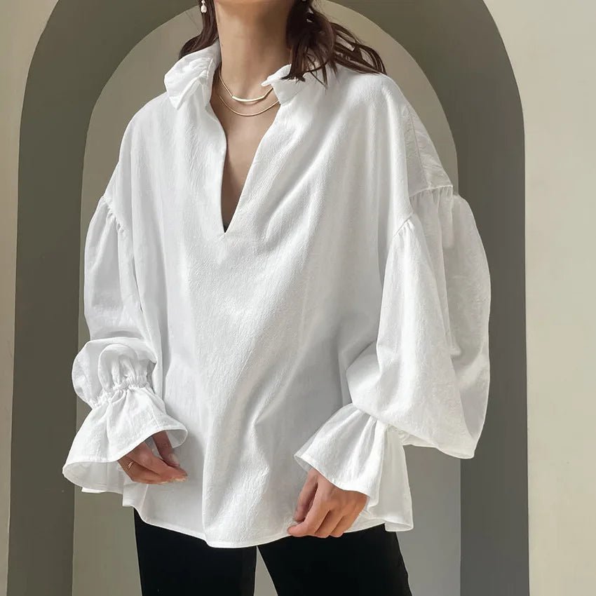 Blusa Lola a maniche lunghe a sbuffo con scollo a V